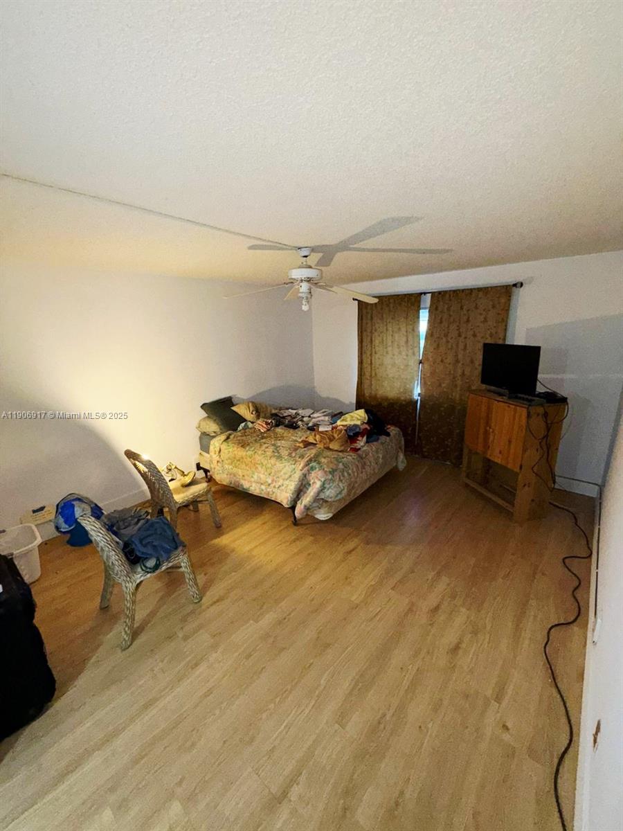 440 Lakeview Drive, Unit 102 Weston, FL 33326 - Photo 8 of 19 a bedroom with bed and window