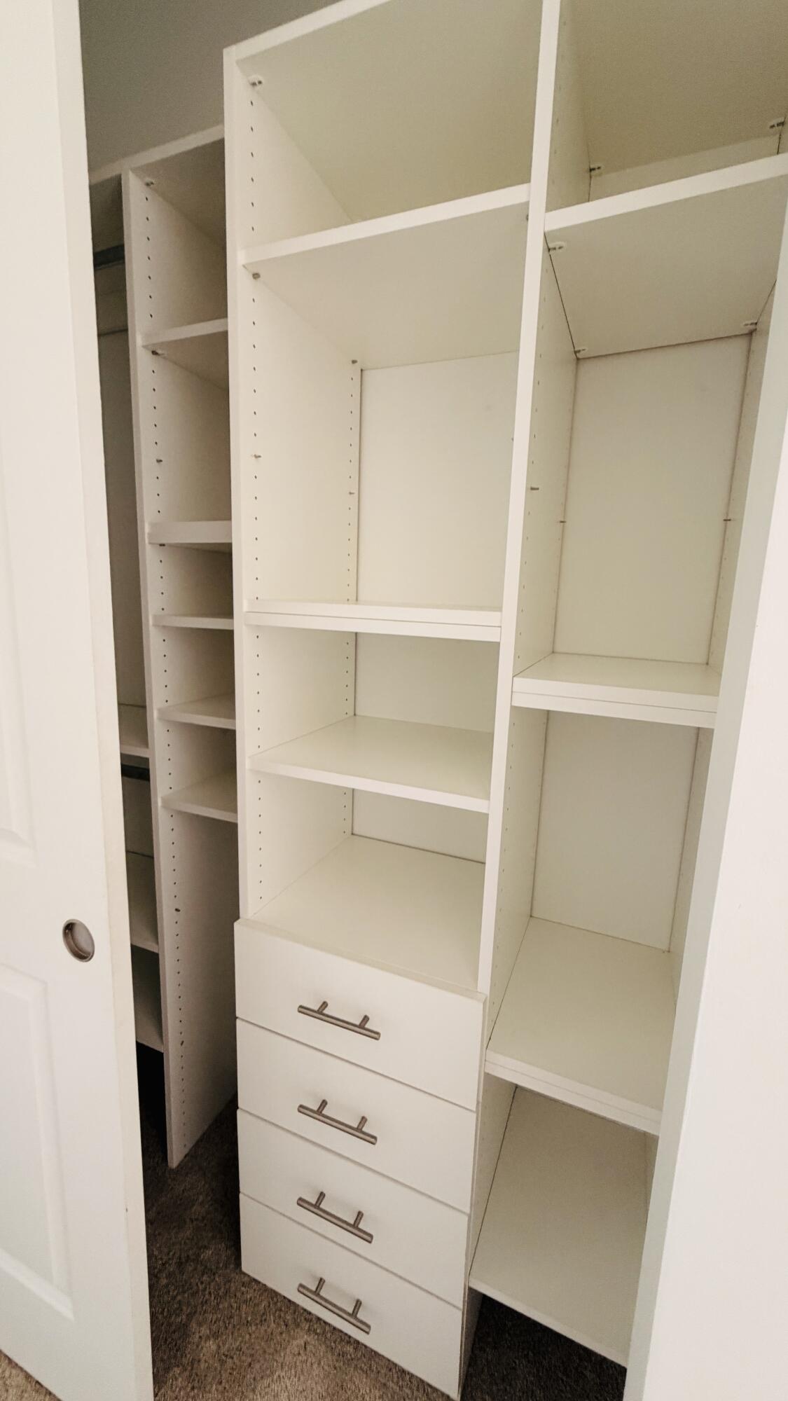 9952 Brickhill Drive Boca Raton, FL 33428 - Photo 14 of 24 a view of walk in closet with empty racks