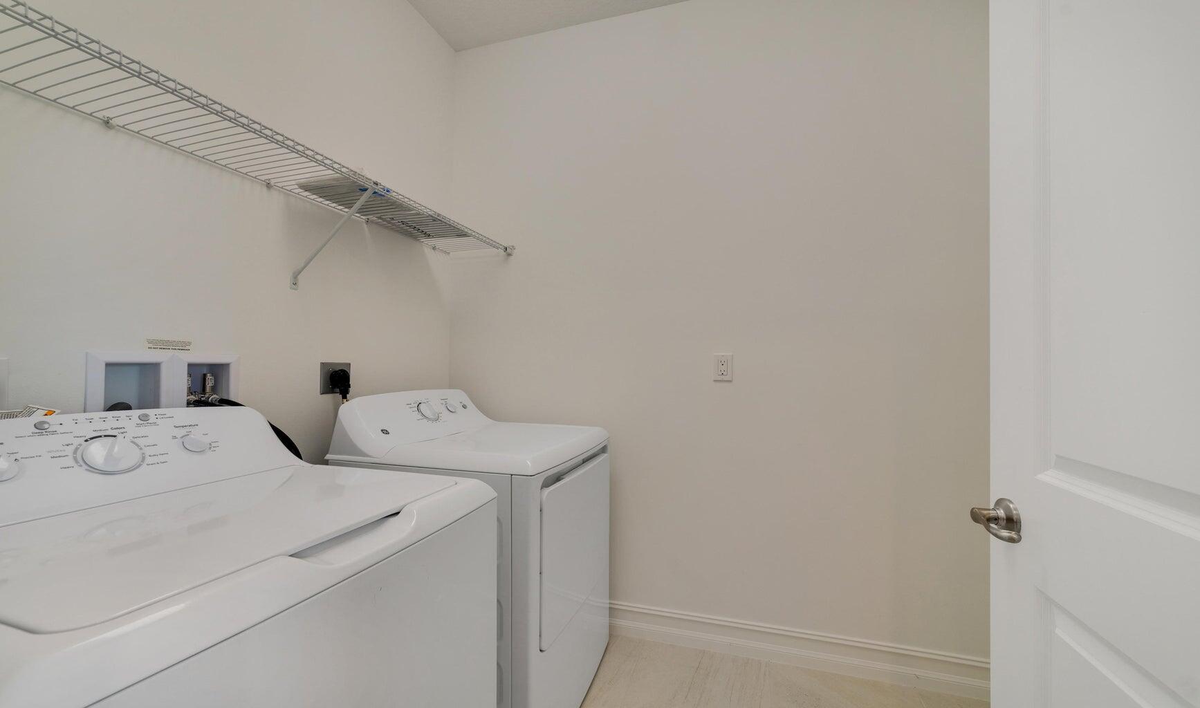 9952 Brickhill Drive Boca Raton, FL 33428 - Photo 16 of 24 a utility room with dryer and washer
