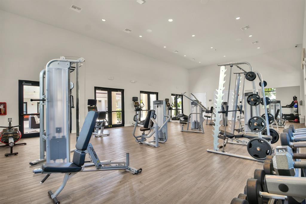 9952 Brickhill Drive Boca Raton, FL 33428 - Photo 22 of 24 a view of a room with gym equipment