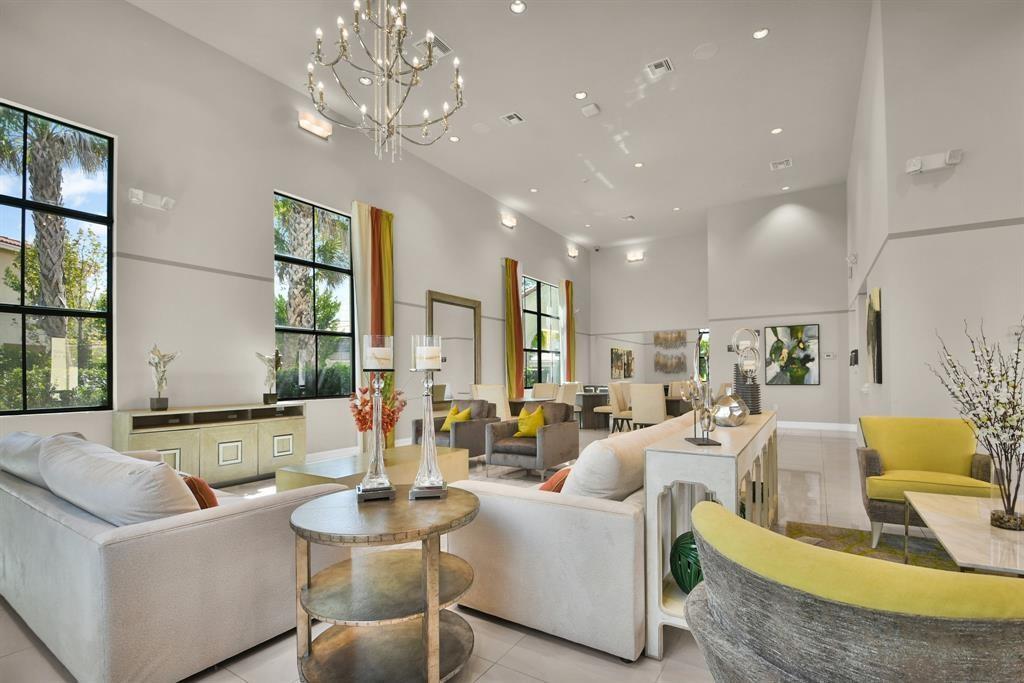 9952 Brickhill Drive Boca Raton, FL 33428 - Photo 24 of 24 a living room with fireplace furniture and a chandelier