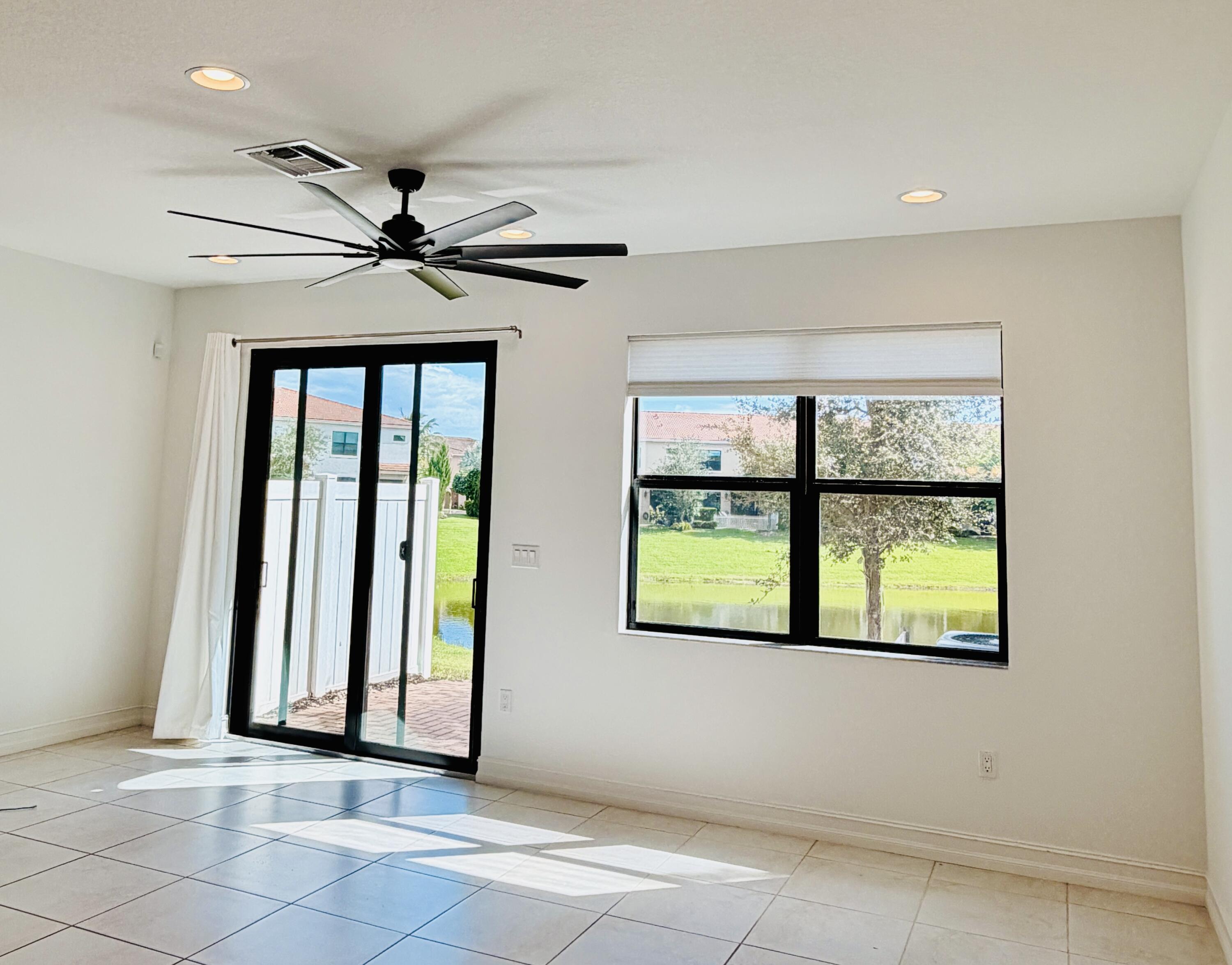 9952 Brickhill Drive Boca Raton, FL 33428 - Photo 3 of 24 an empty room with windows and closet