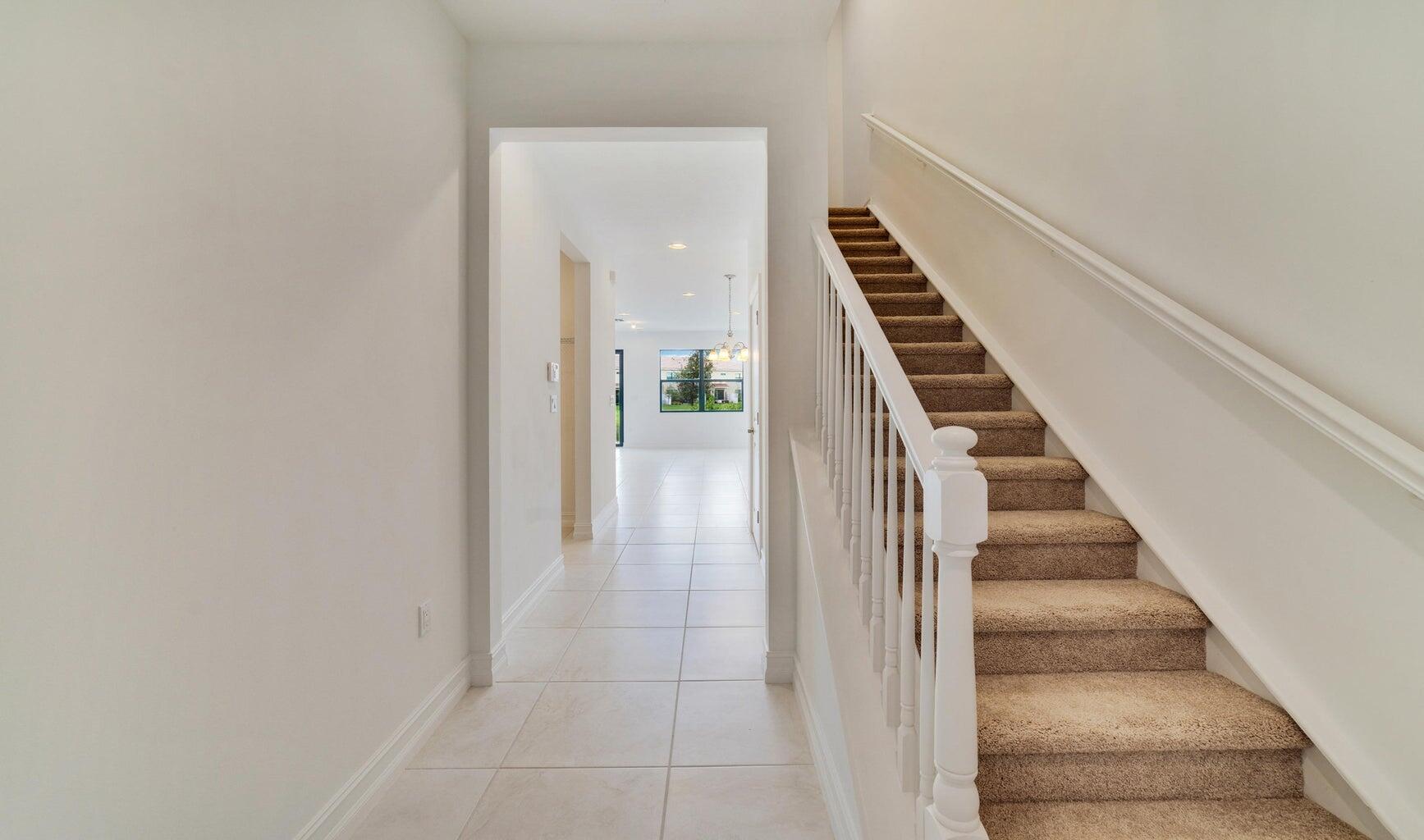 9952 Brickhill Drive Boca Raton, FL 33428 - Photo 6 of 24 a view of an entryway with wooden floor