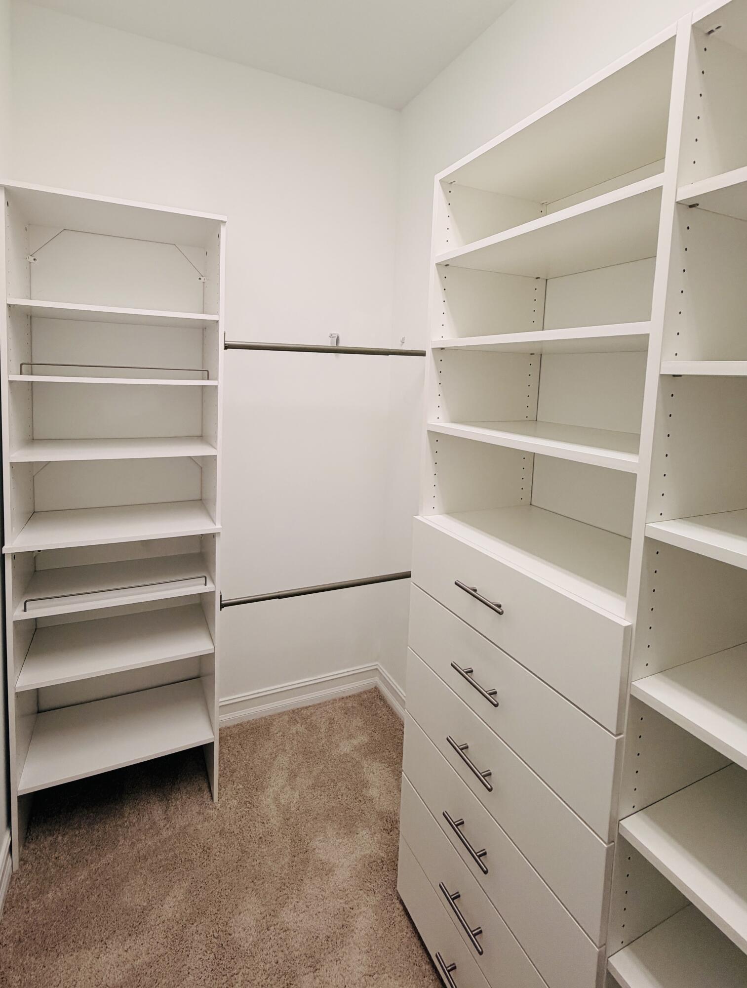 9952 Brickhill Drive Boca Raton, FL 33428 - Photo 9 of 24 a view of walk in closet with empty racks