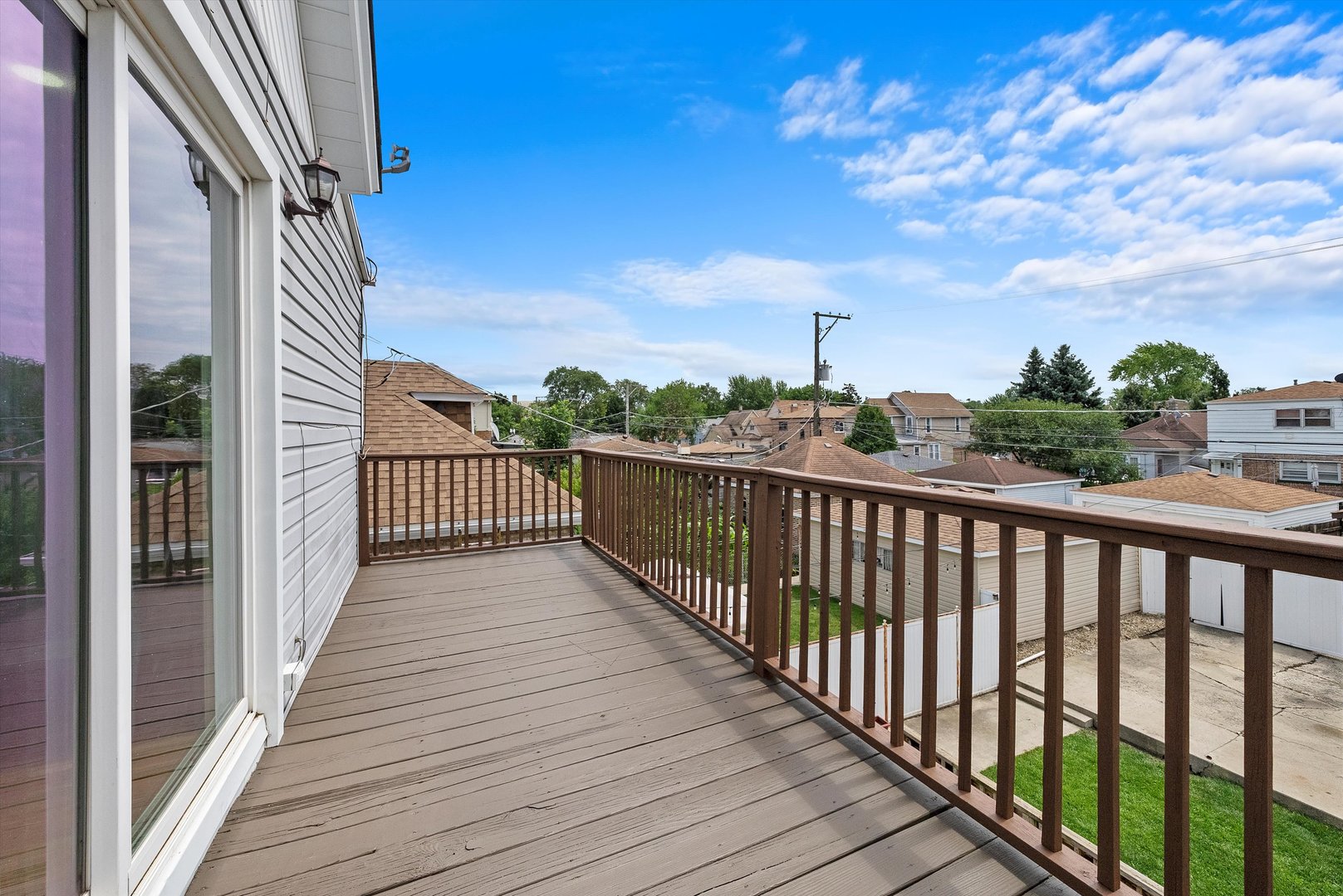 3343 West 59th Place, Unit 2 Chicago, IL 60629 - Photo 2 of 10 a view of a balcony with wooden floor