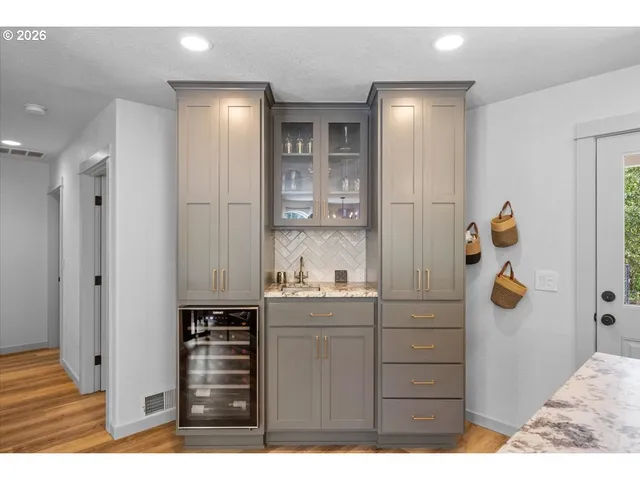 a bathroom with a sink and mirror