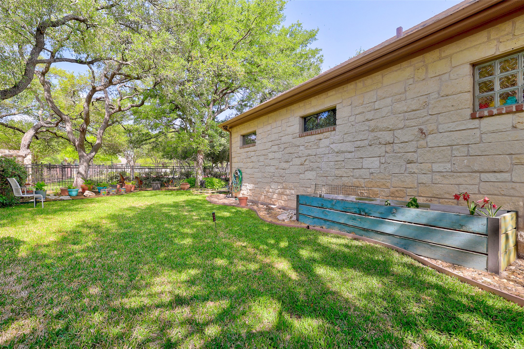 805 Boquilla Trail Georgetown, TX 78633 - Photo 39 of 40 a view of backyard with wooden fence and large trees