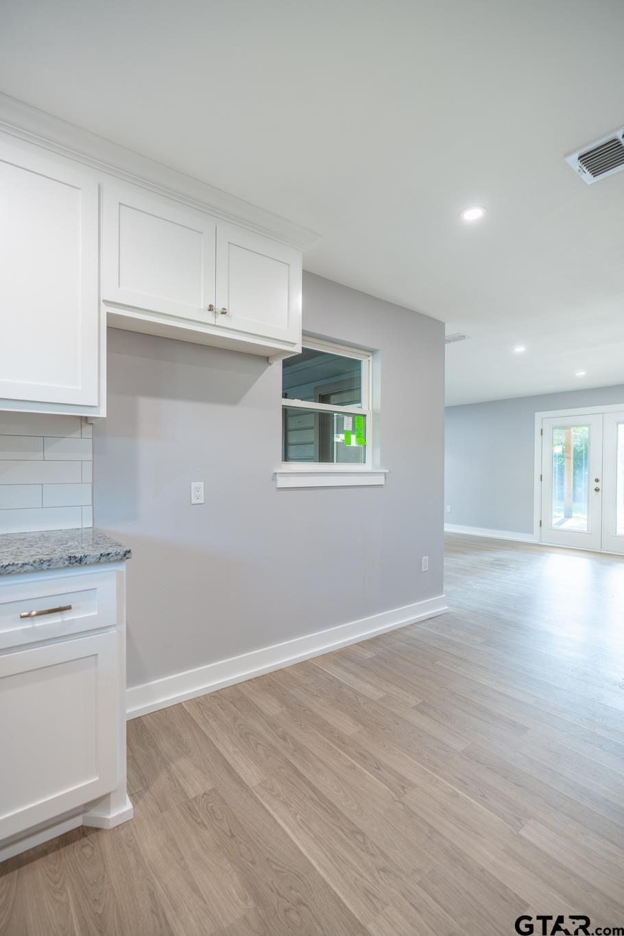 2922 West Azalea Drive Tyler, TX 75701 - Photo 17 of 39 a view of a kitchen with a stove top oven