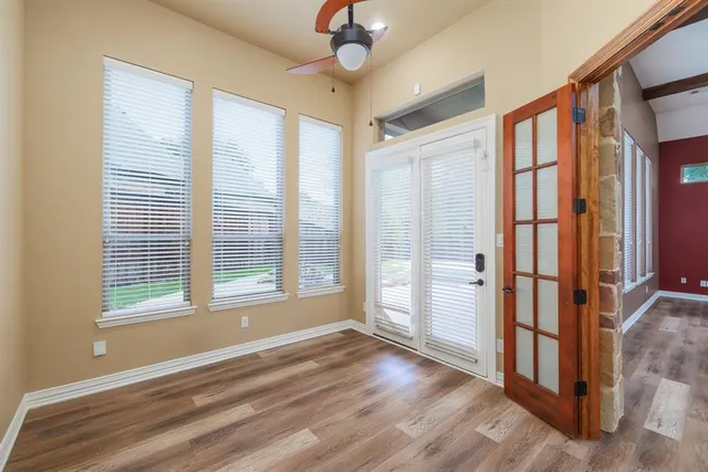 a view of an empty room with a window