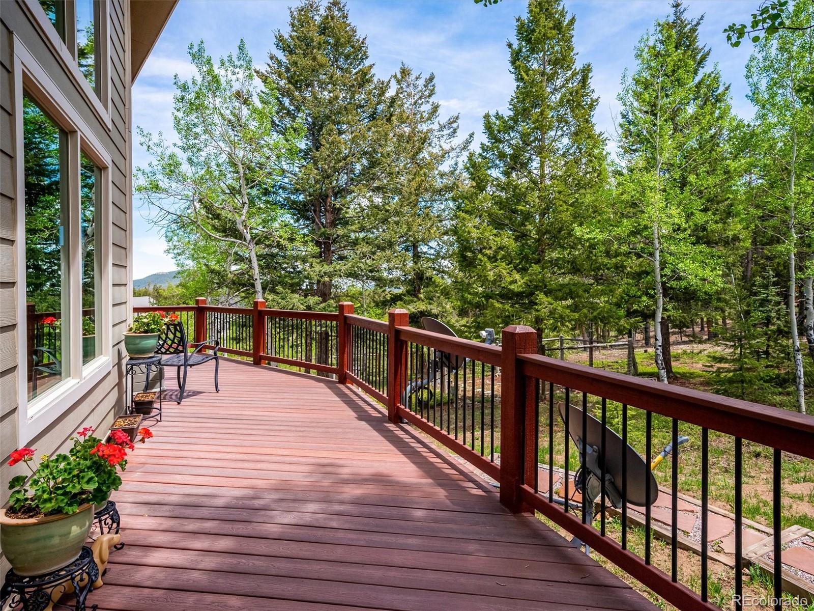 9390 South Warhawk Road Conifer, CO 80433 - Photo 31 of 46 a view of balcony with chairs