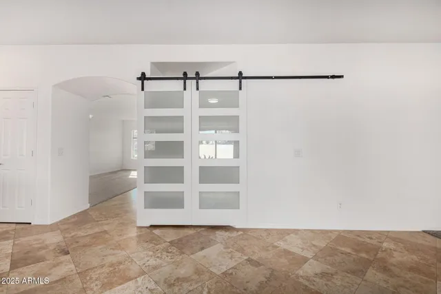 a kitchen with a sink a refrigerator and a stove top oven