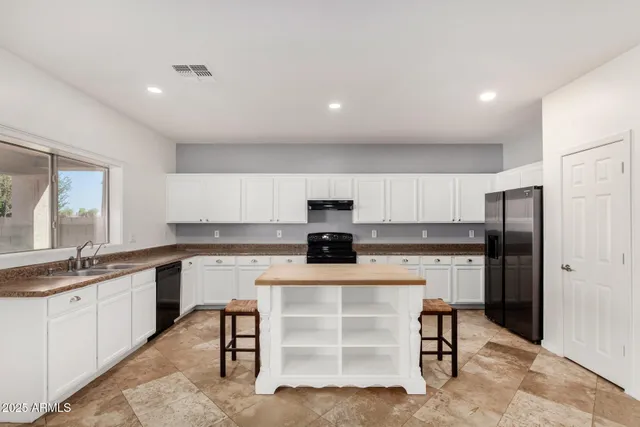 a kitchen with a stove and a sink