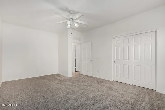 a bathroom with a bathtub shower sink vanity mirror and toilet