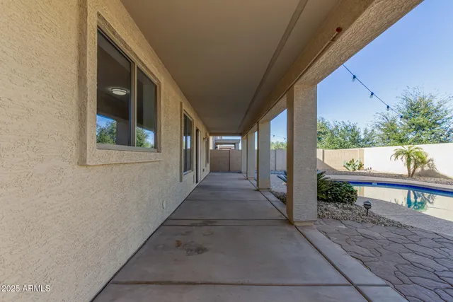 a view of a swimming pool with a patio