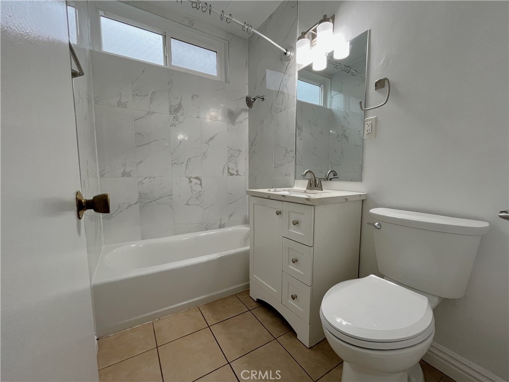 12926 Doty Avenue, Unit 9 Hawthorne, CA 90250 - Photo 8 of 12 a bathroom with a sink toilet and shower
