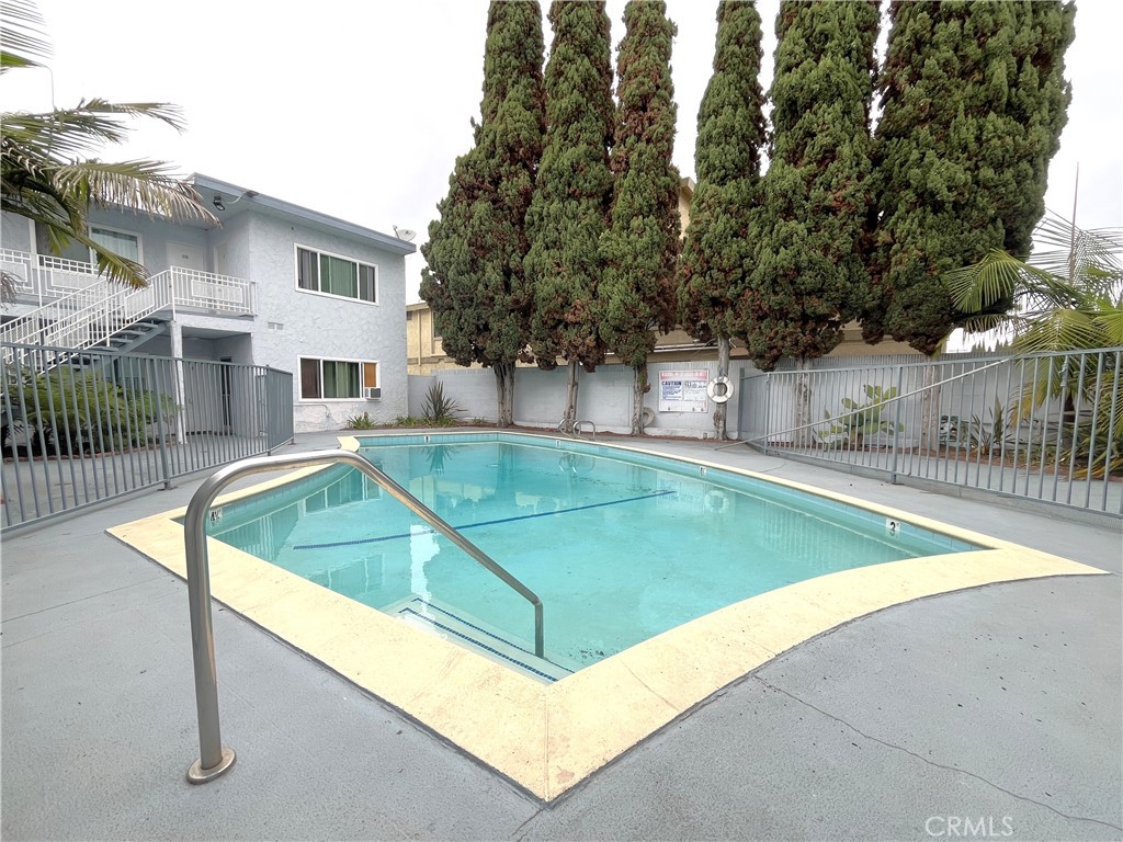 12926 Doty Avenue, Unit 9 Hawthorne, CA 90250 - Photo 10 of 12 a view of a backyard with a small pool and sitting area