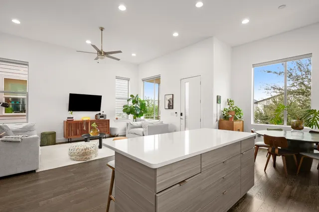 an aerial view of residential houses with outdoor space