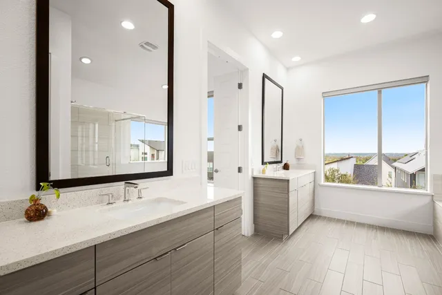 a bathroom with a tub and shower