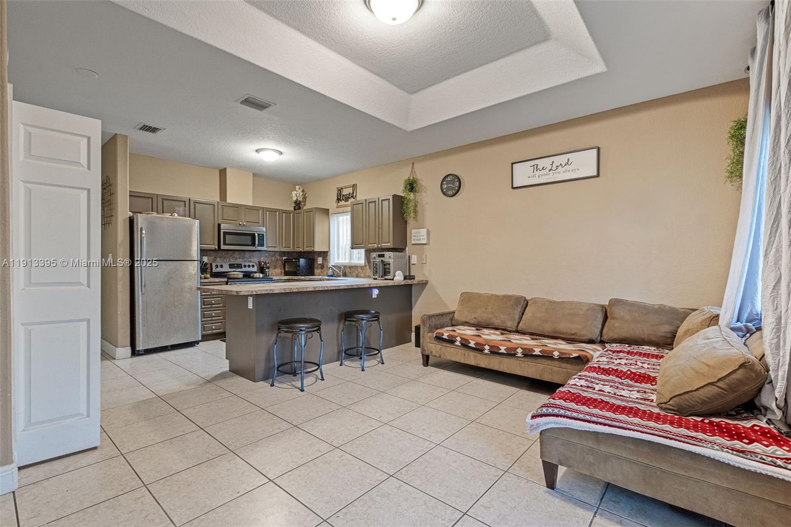 211 Southwest 15th Terrace Homestead, FL 33030 - Photo 13 of 26 a living room with furniture and kitchen view
