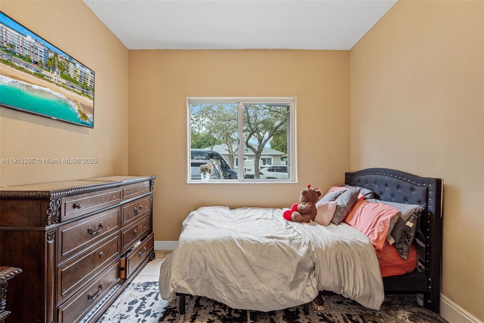 211 Southwest 15th Terrace Homestead, FL 33030 - Photo 15 of 26 a bedroom with a bed and a window