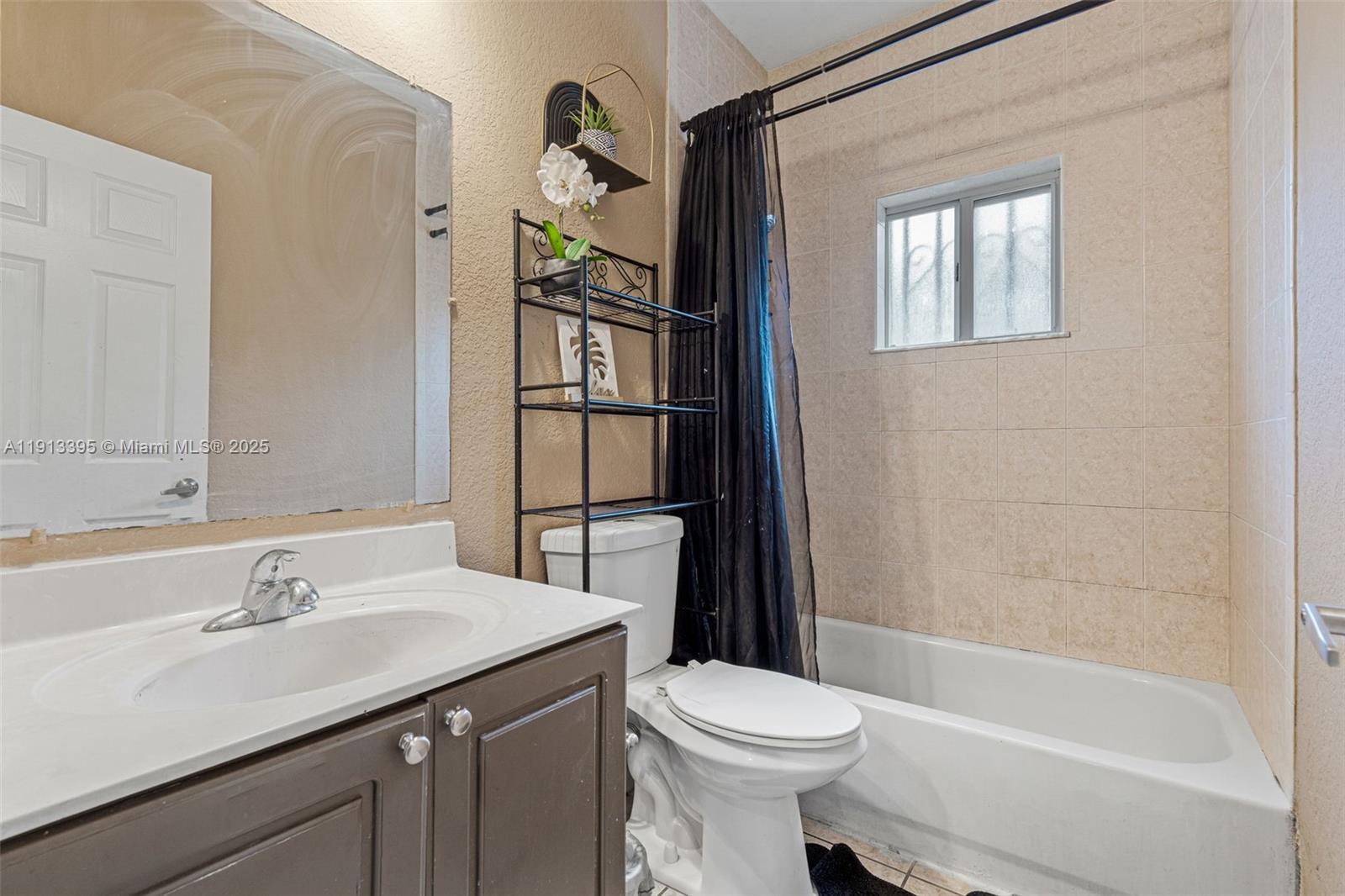 211 Southwest 15th Terrace Homestead, FL 33030 - Photo 18 of 26 a bathroom with a sink toilet and shower