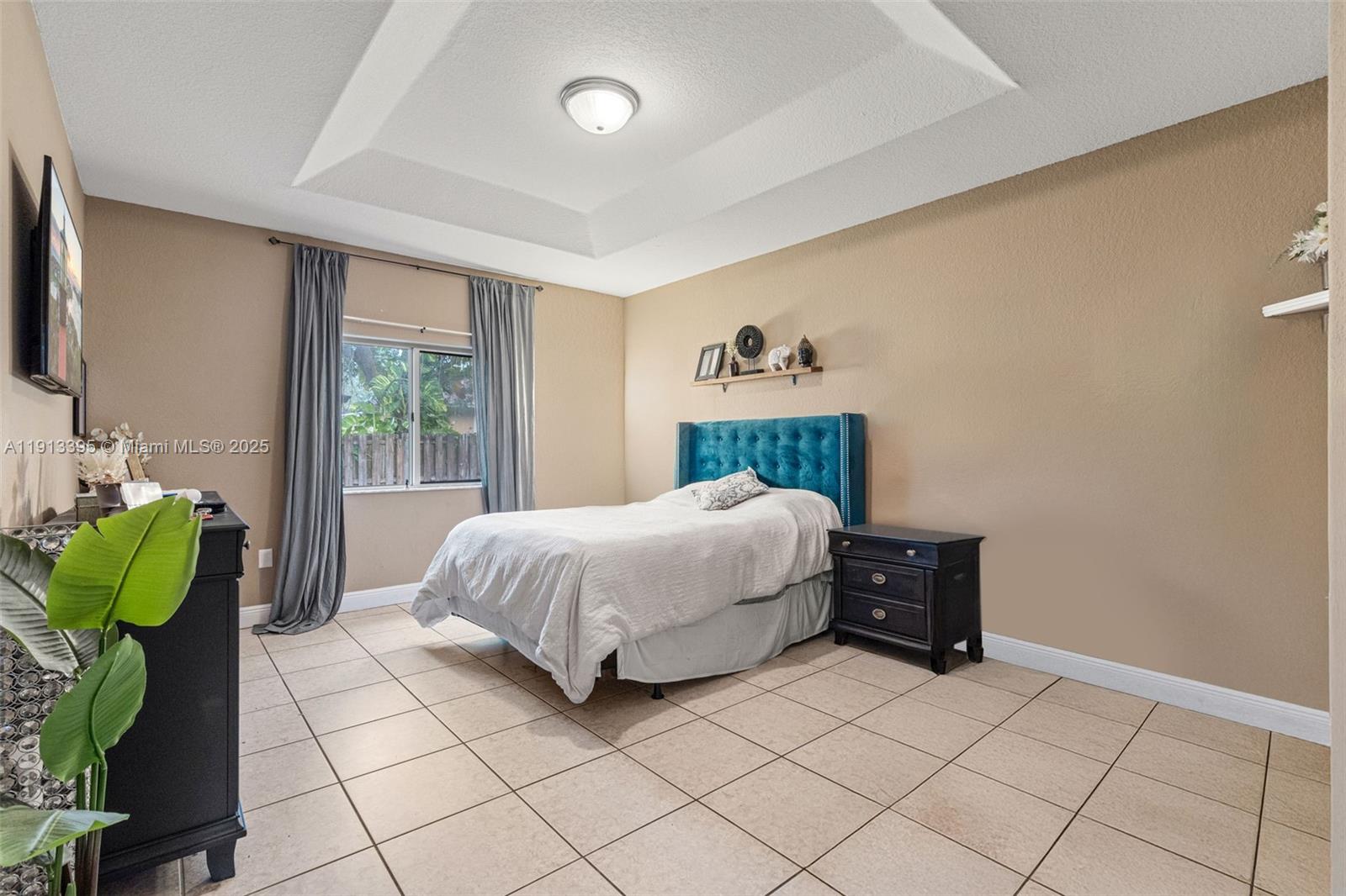 211 Southwest 15th Terrace Homestead, FL 33030 - Photo 19 of 26 a bedroom with a bed and a window