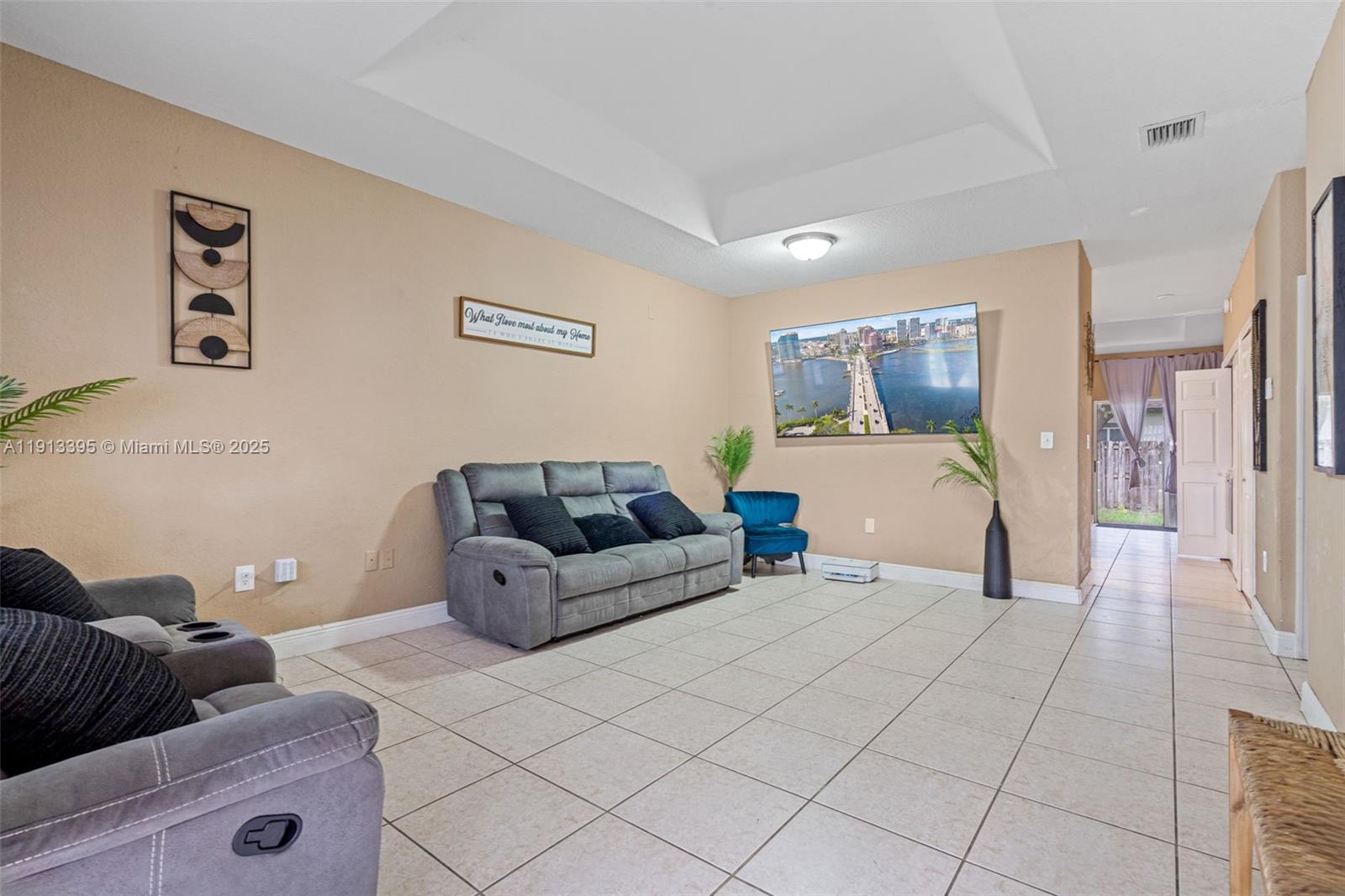 211 Southwest 15th Terrace Homestead, FL 33030 - Photo 4 of 26 a bed room with bed and a couch