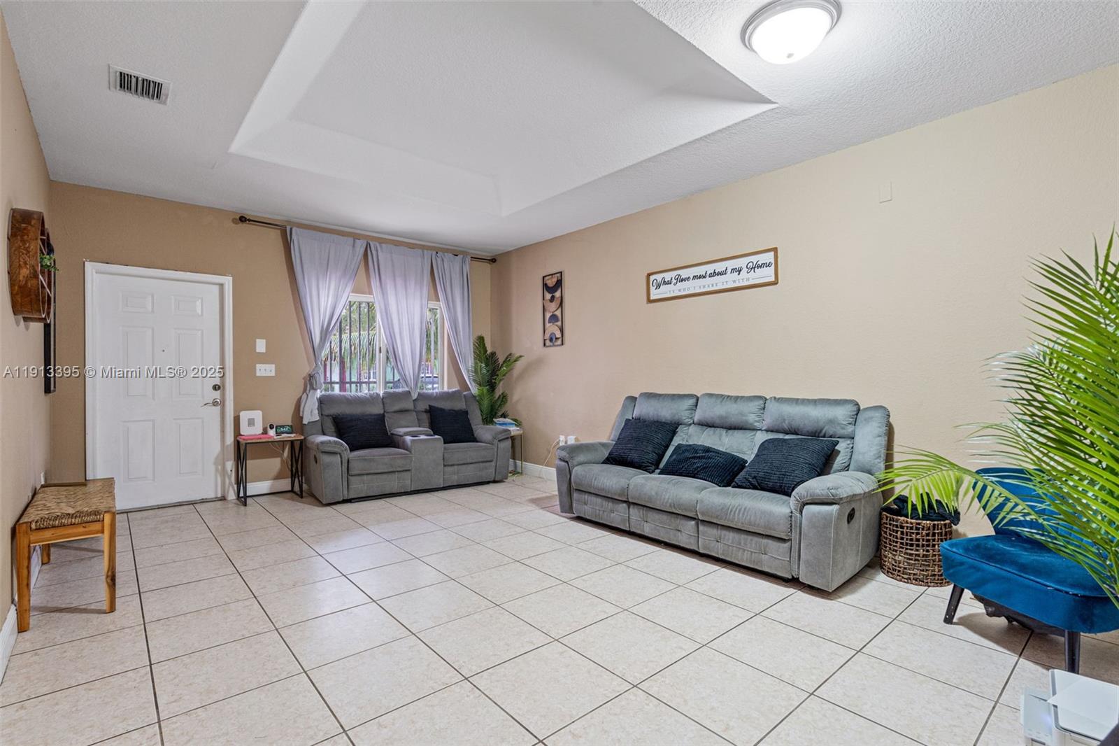211 Southwest 15th Terrace Homestead, FL 33030 - Photo 7 of 26 a living room with furniture and a couch