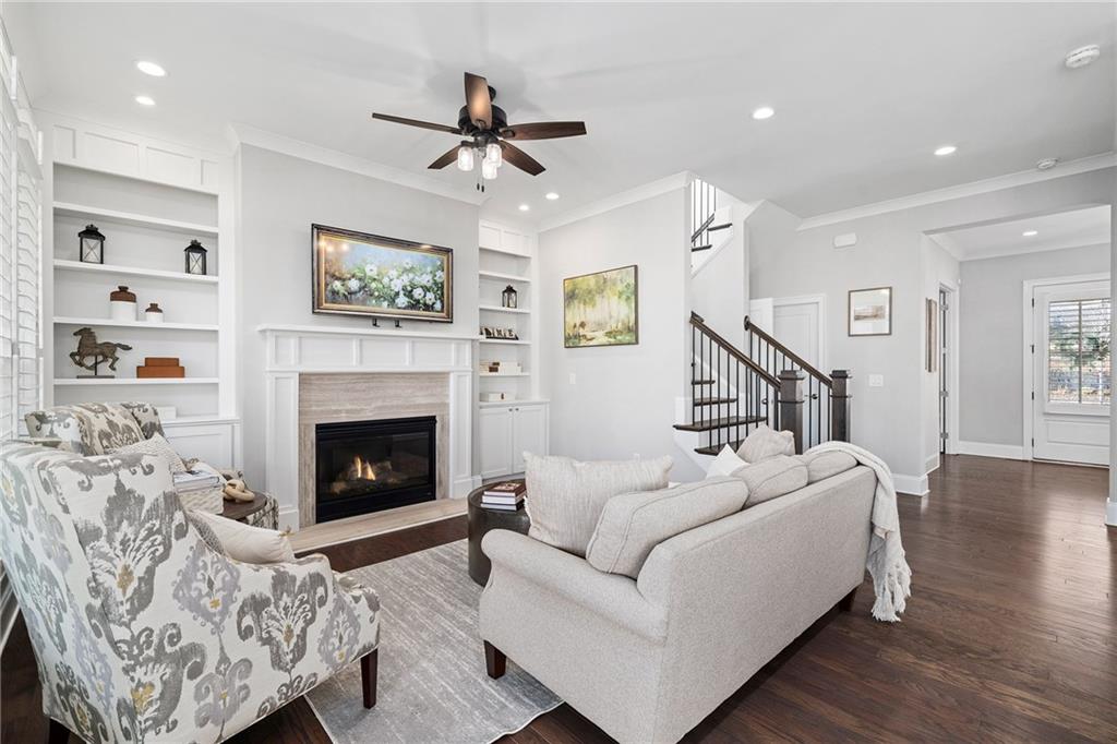 165 Rowan Avenue Alpharetta, GA 30009 - Photo 15 of 84 a living room with furniture and a fireplace