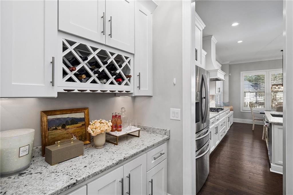 165 Rowan Avenue Alpharetta, GA 30009 - Photo 21 of 84 a kitchen with stainless steel appliances granite countertop a sink stove and cabinets