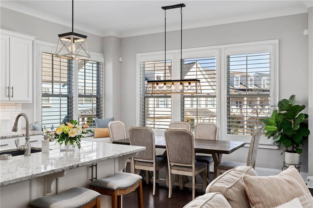 165 Rowan Avenue Alpharetta, GA 30009 - Photo 25 of 84 a dining room with furniture a chandelier and window