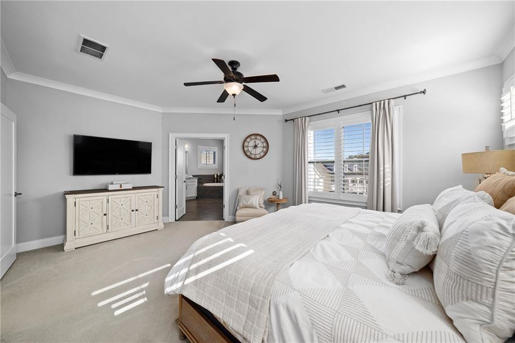 165 Rowan Avenue Alpharetta, GA 30009 - Photo 31 of 84 a bedroom with a bed and a flat screen tv