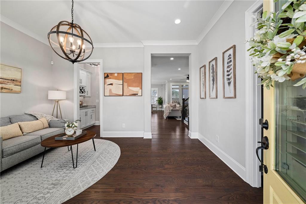 165 Rowan Avenue Alpharetta, GA 30009 - Photo 6 of 84 a view of a livingroom with furniture wooden floor and a chandelier