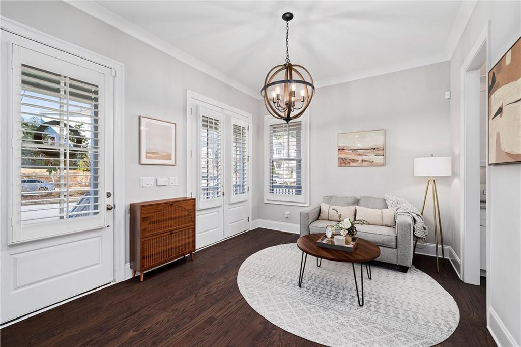 165 Rowan Avenue Alpharetta, GA 30009 - Photo 7 of 84 a living room with furniture a window and a table