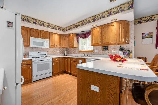 a kitchen with a sink appliances and cabinets
