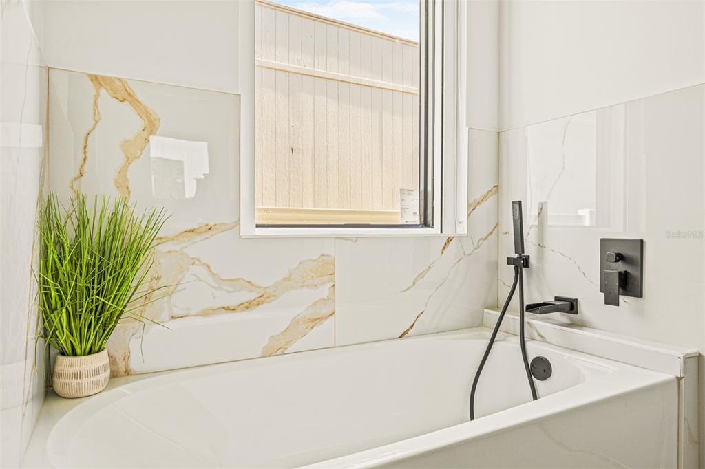 6336 Chorus Drive Mascotte, FL 34753 - Photo 12 of 21 a bathroom with a tub and a sink