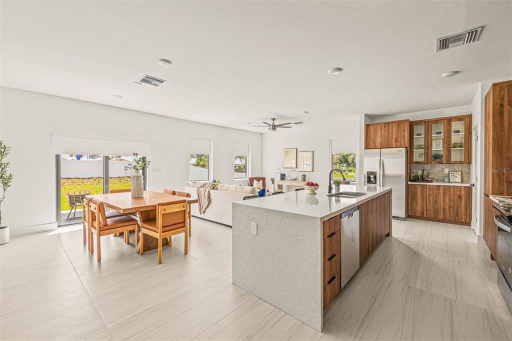 6336 Chorus Drive Mascotte, FL 34753 - Photo 13 of 21 a living room with stainless steel appliances kitchen island granite countertop furniture and a kitchen view