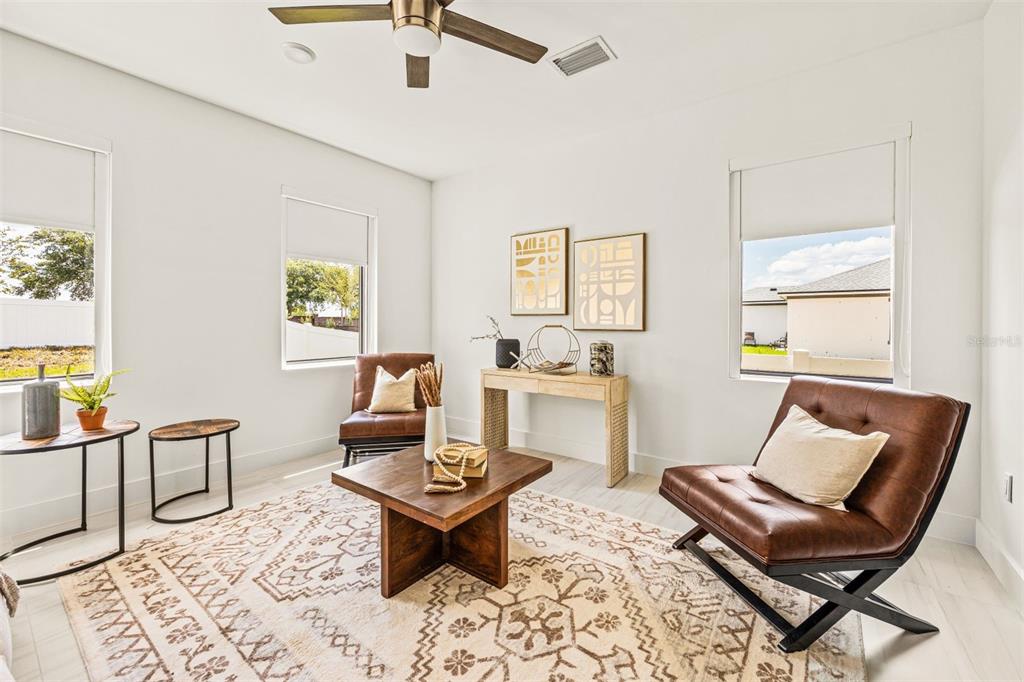 6336 Chorus Drive Mascotte, FL 34753 - Photo 15 of 21 a living room with furniture and a window