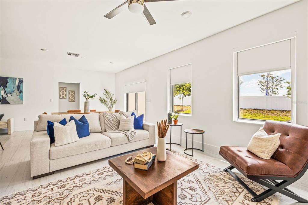 6336 Chorus Drive Mascotte, FL 34753 - Photo 16 of 21 a living room with furniture and a rug