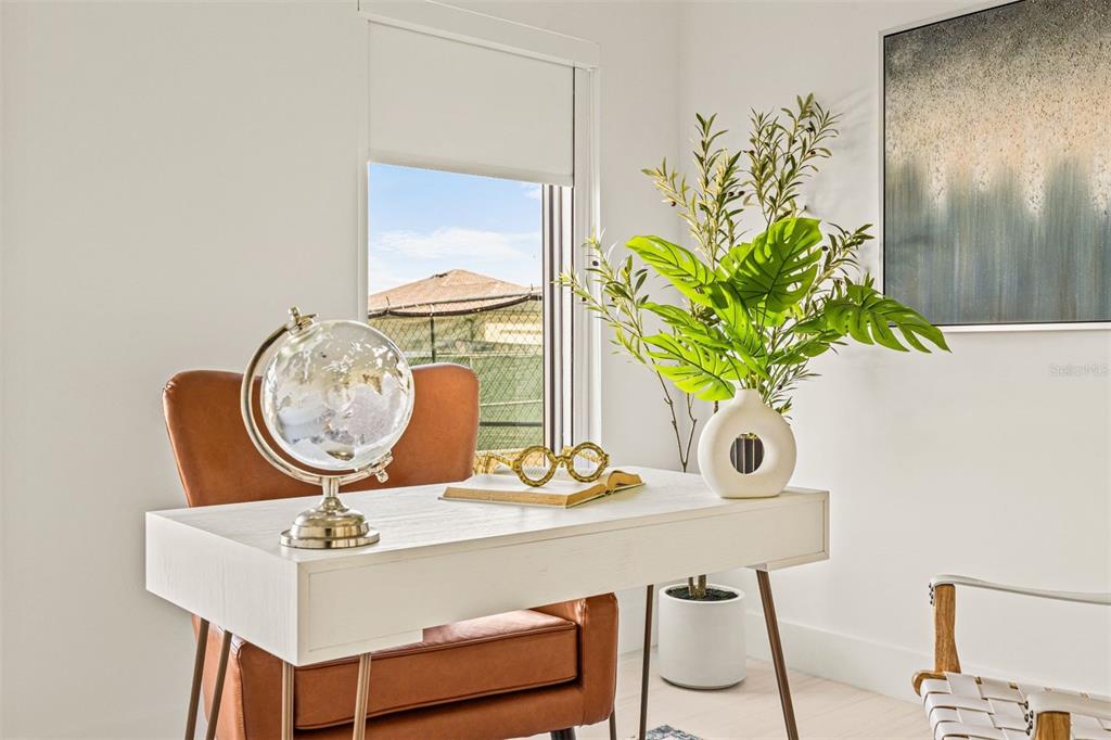 6336 Chorus Drive Mascotte, FL 34753 - Photo 4 of 21 a table with a vase and flowers on it