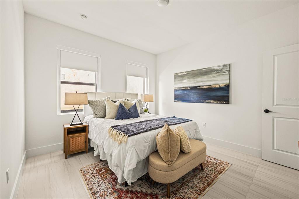 6336 Chorus Drive Mascotte, FL 34753 - Photo 8 of 21 a bedroom with bed and window