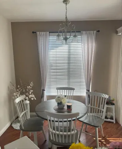 a view of a dining room with furniture window and outside view