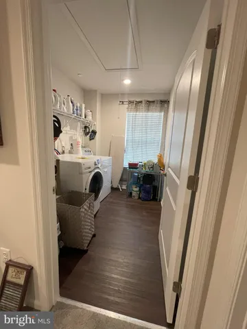 a view of living room with furniture and a fireplace