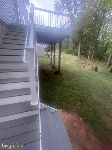 a view of a porch with wooden floor