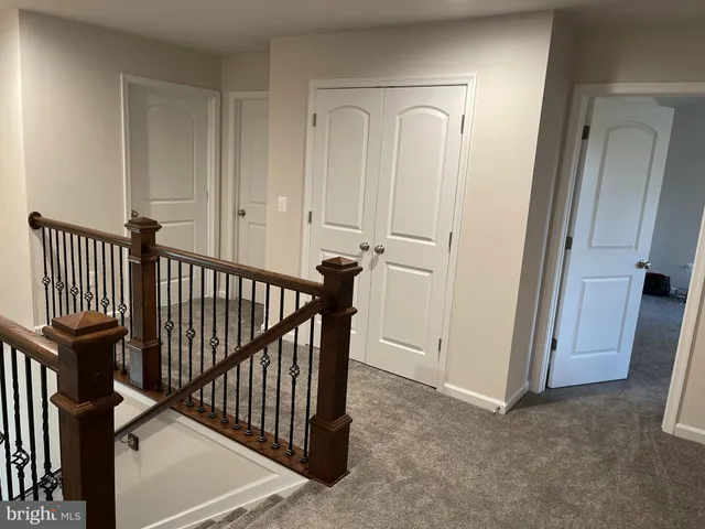 a view of a hallway with staircase