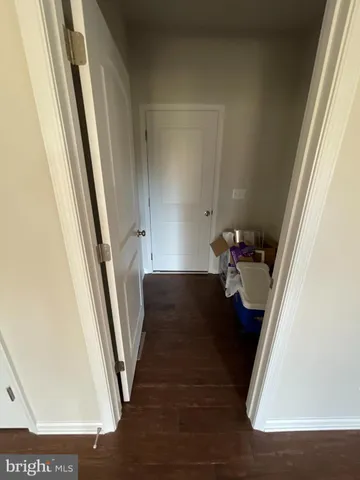 a view of a hardwood floor and stairs