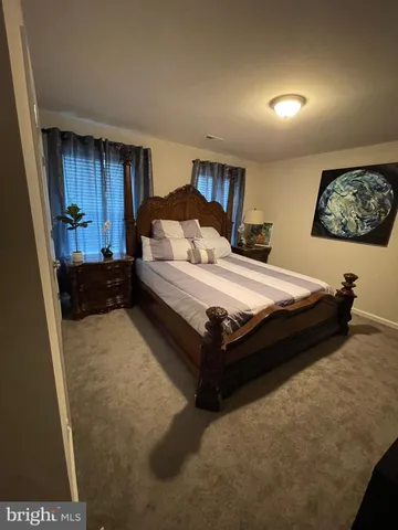 a view of a bedroom with furniture and staircase