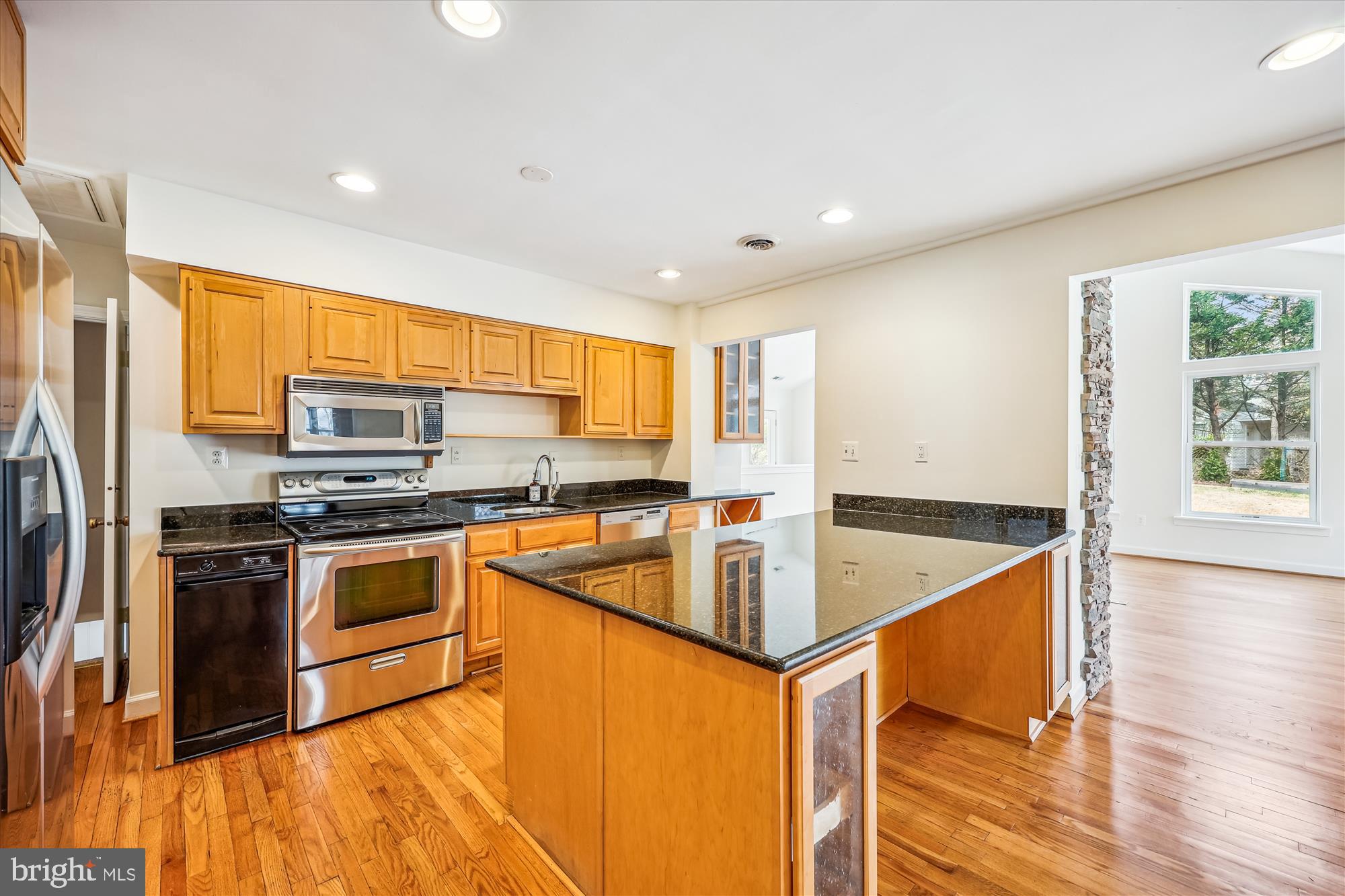 411 Pershing Drive Silver Spring, MD 20910 - Photo 14 of 64 a kitchen with stainless steel appliances granite countertop a sink a stove and a refrigerator