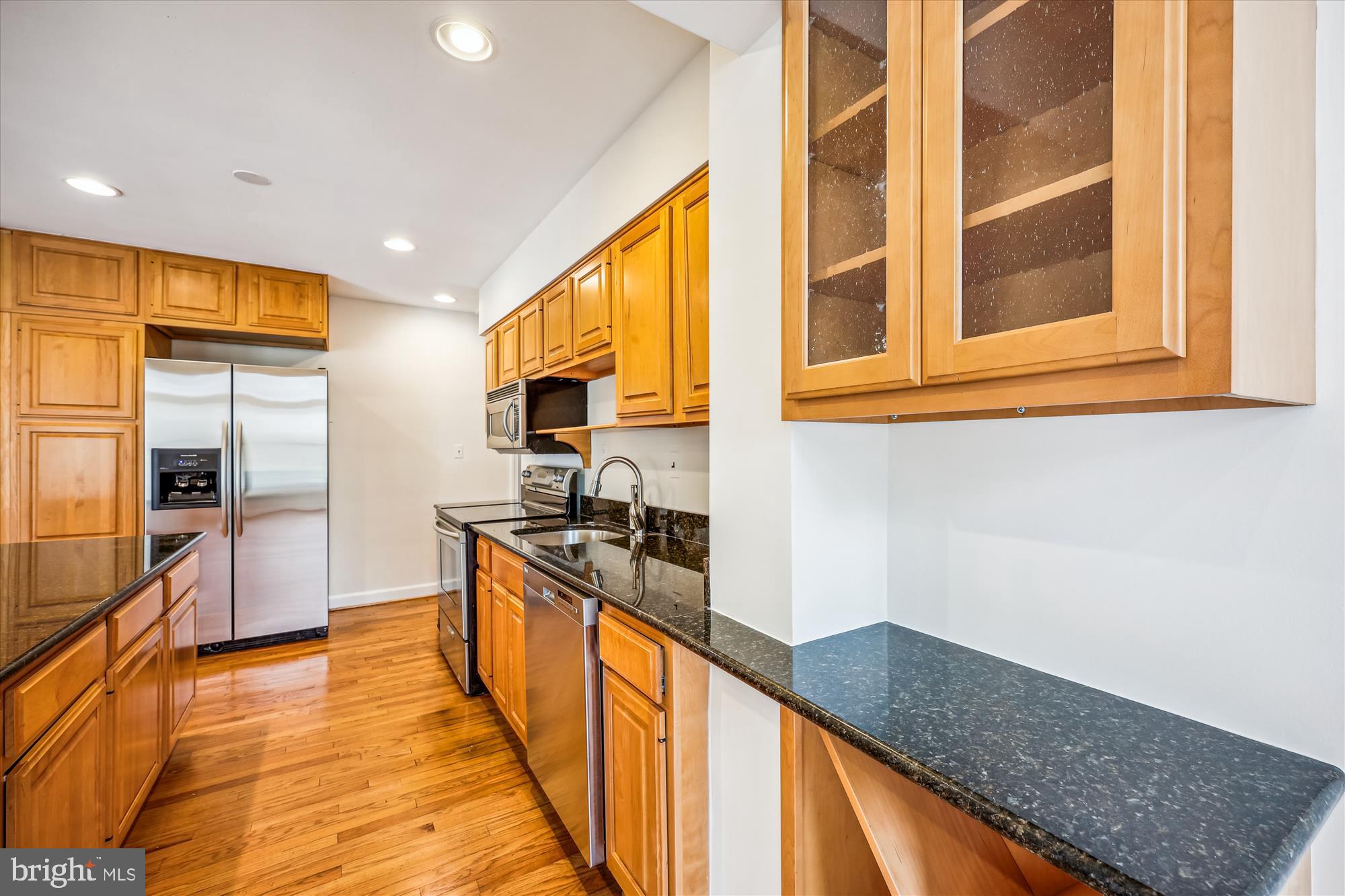411 Pershing Drive Silver Spring, MD 20910 - Photo 17 of 64 a kitchen with stainless steel appliances granite countertop a sink and a refrigerator