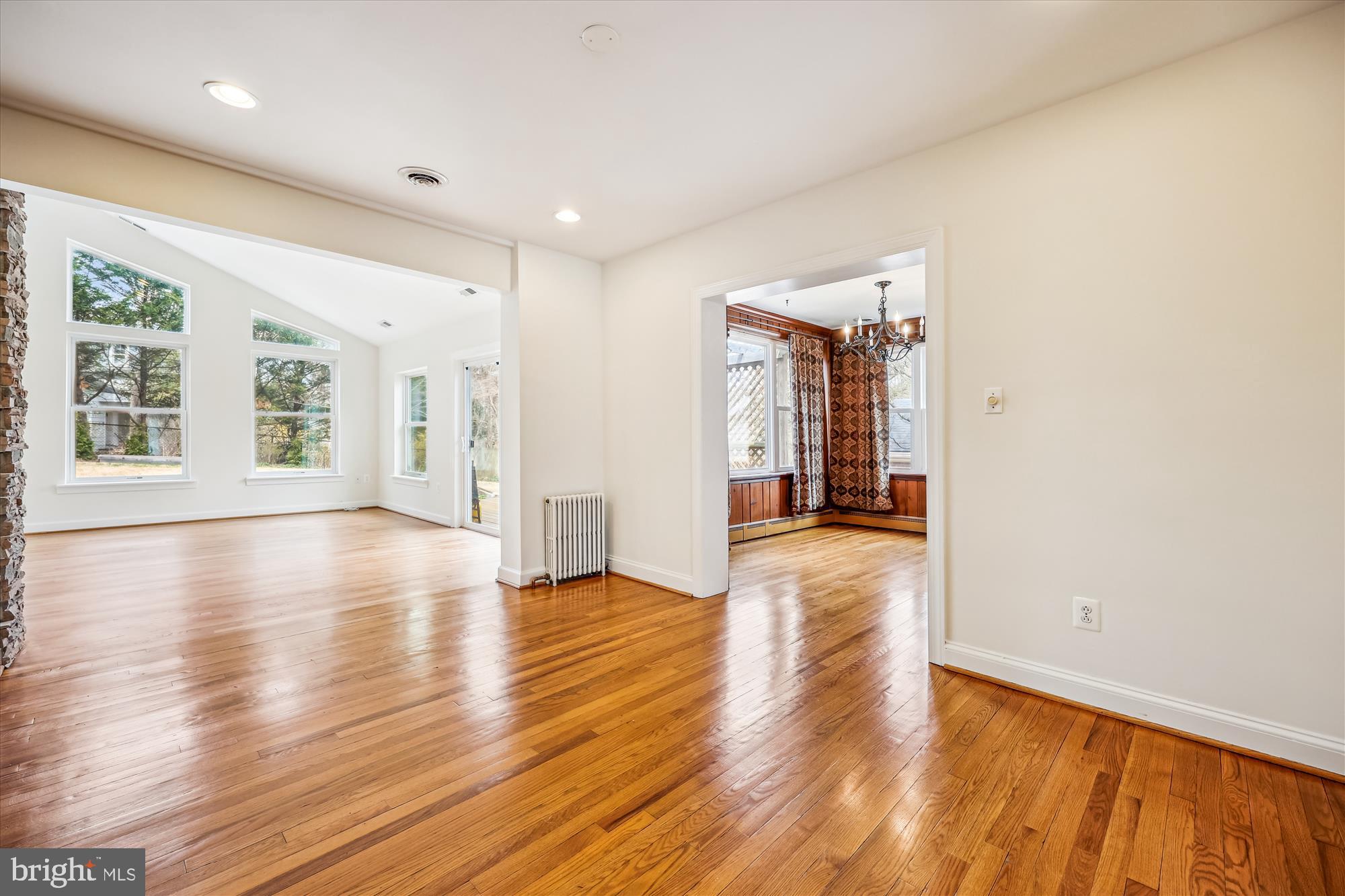 411 Pershing Drive Silver Spring, MD 20910 - Photo 19 of 64 an empty room with wooden floor and windows
